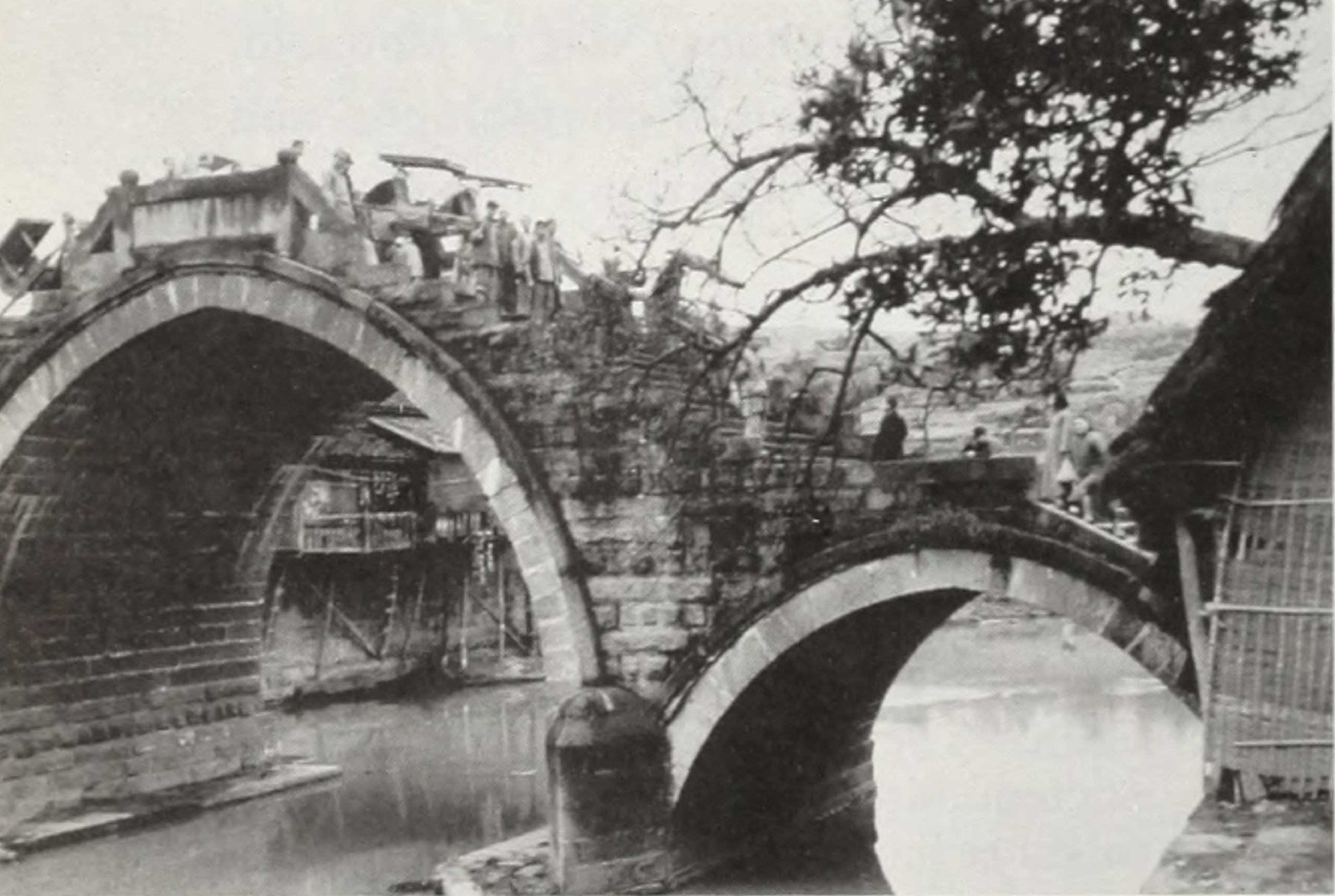 Black-and-white landscape image showing bridge