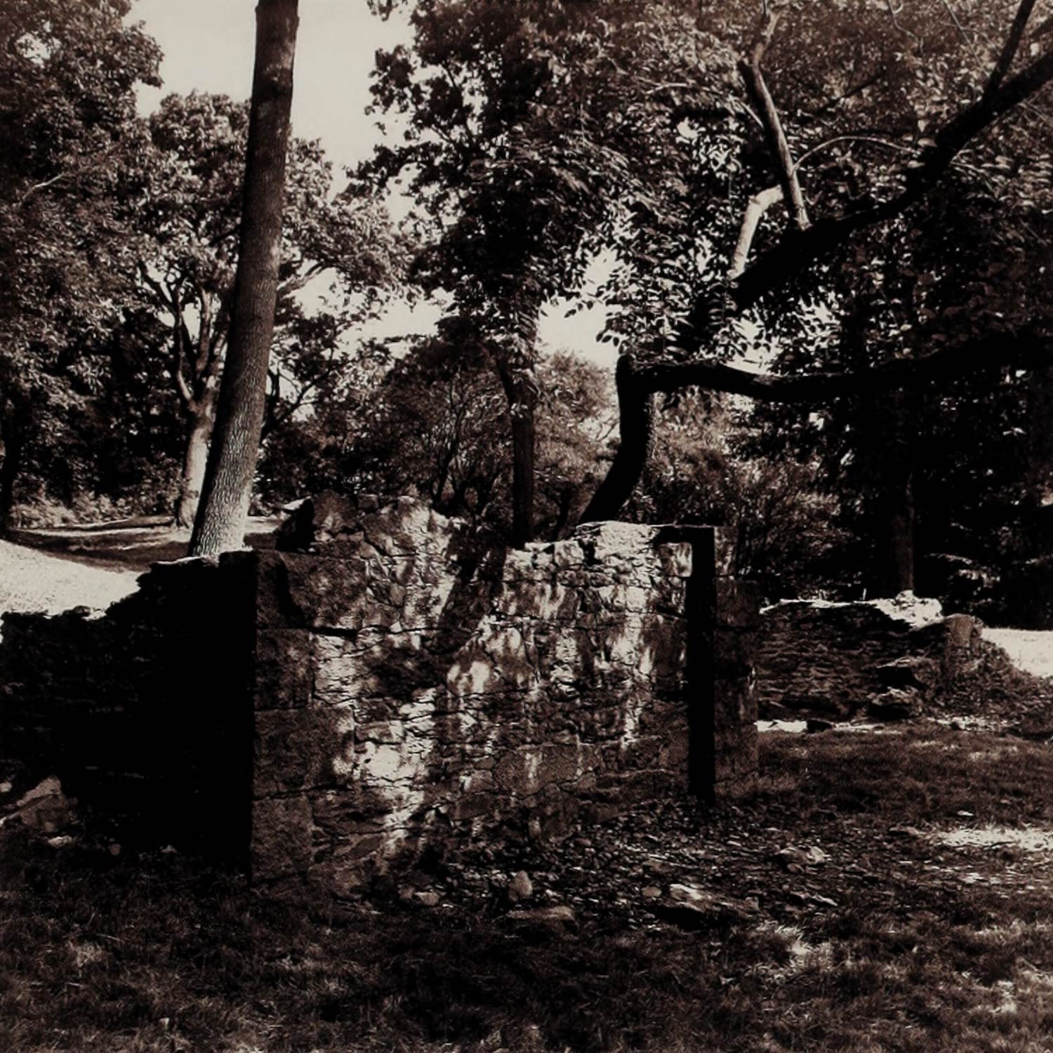 A sepia-tone photo showing remnants of Bussey's outbuildings.