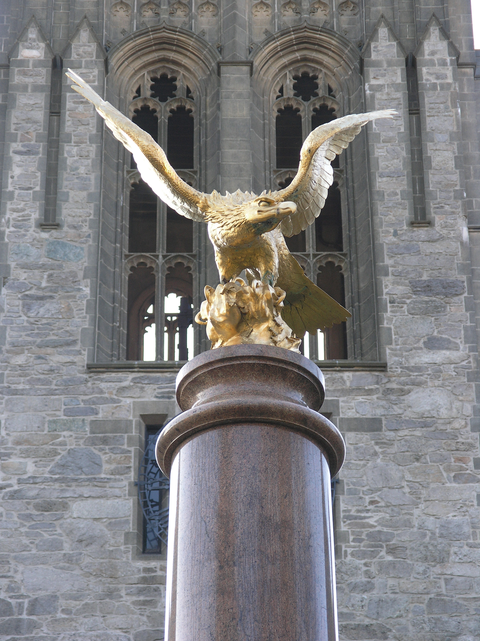 Photograph showing golden eagle on marble pedestal