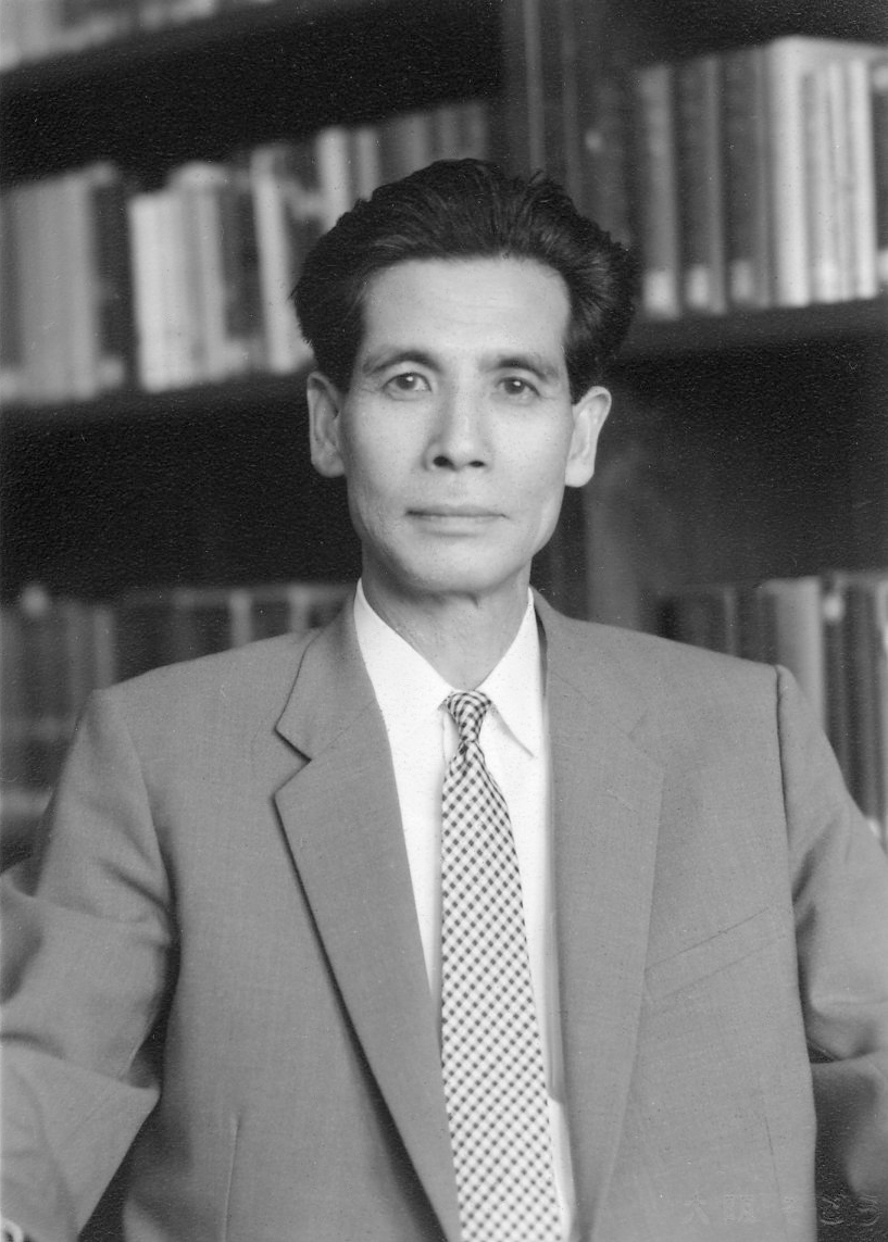 Black-and-white photograph of man wearing suit