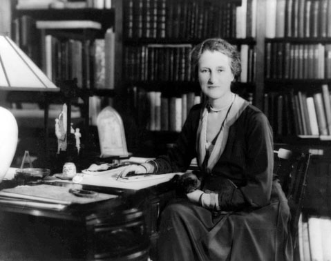 Beatrix Jones Farrand seated at a desk.