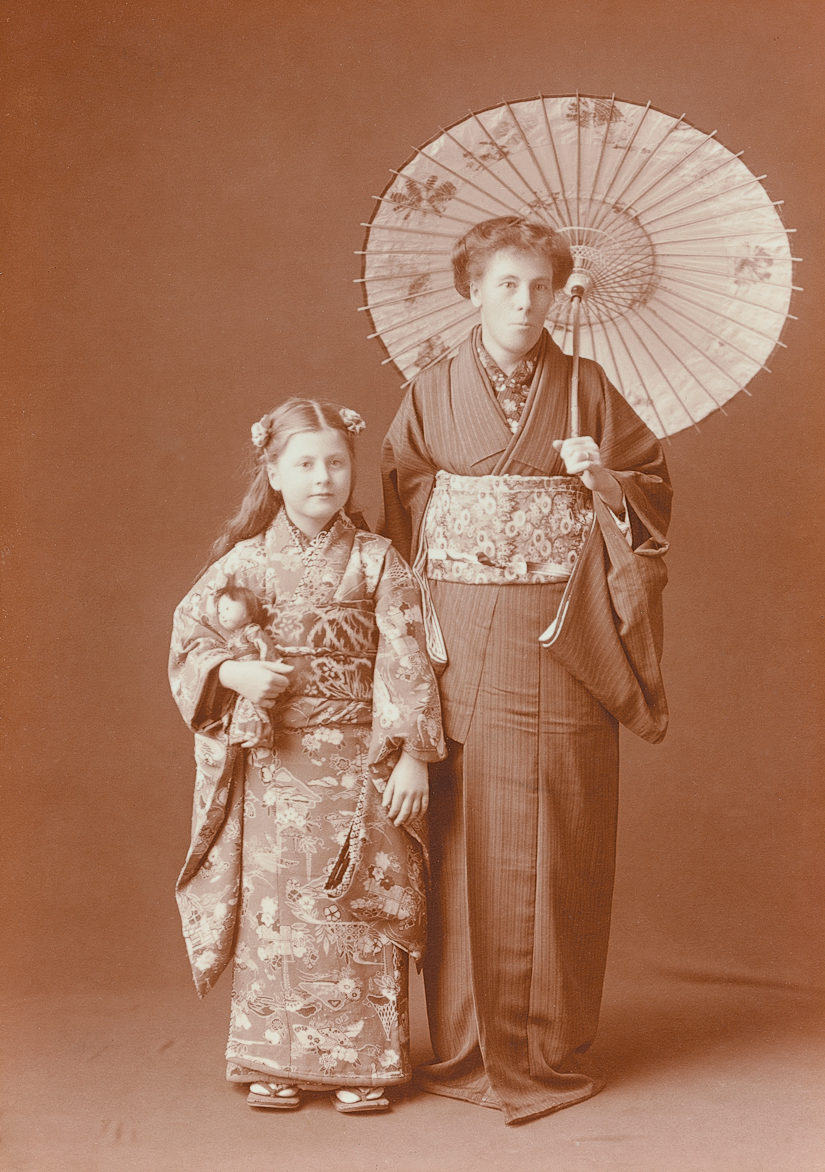 Sepia photograph of woman and young girl wearing kimonos