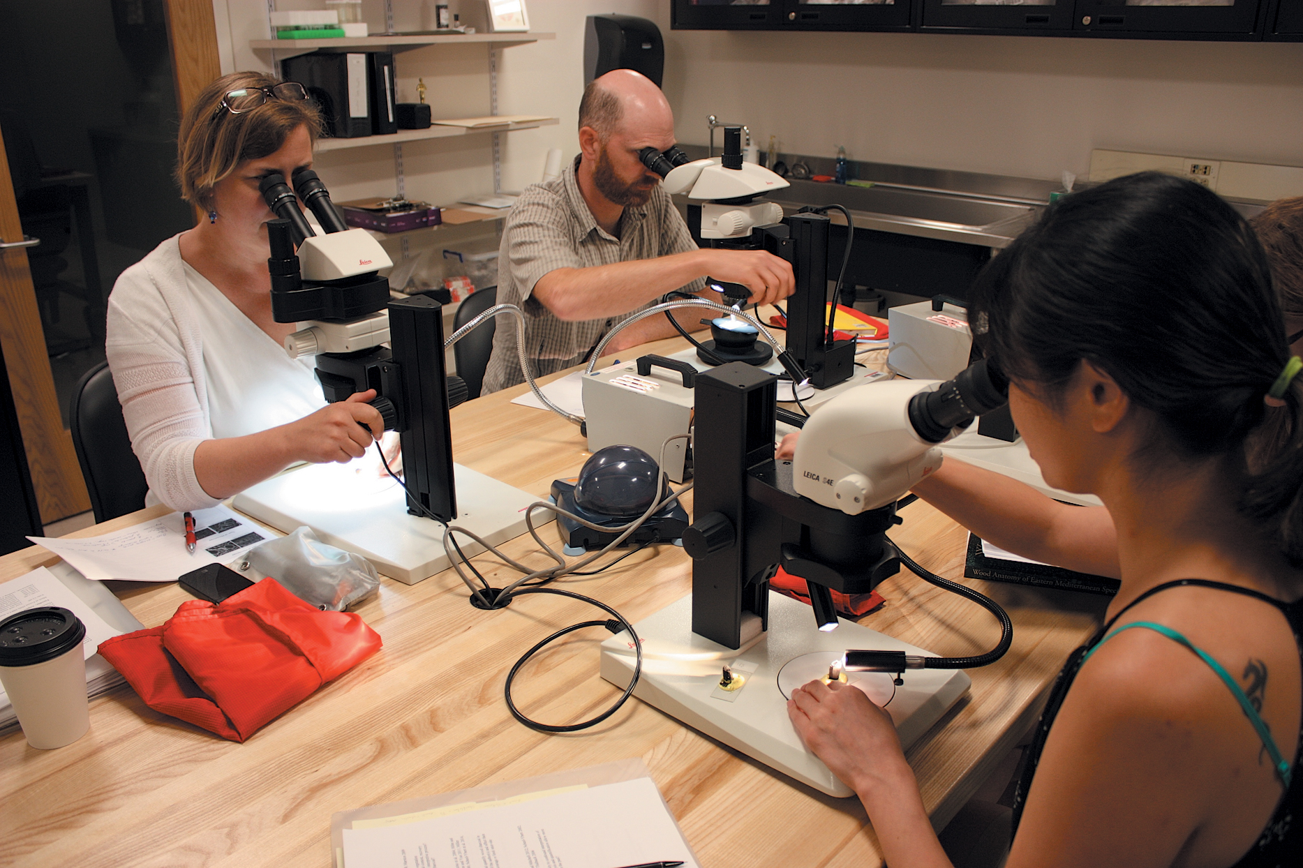 A color photo of a group of people in a lab.