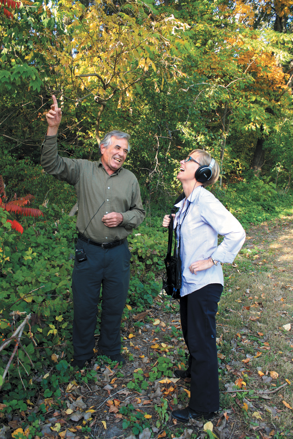 A color photo of two people in Bussey Brook Meadow.