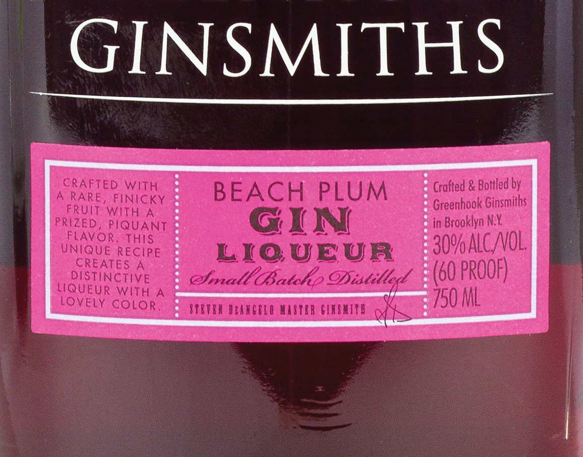 A color photo of the label on a bottle of beach plum gin.
