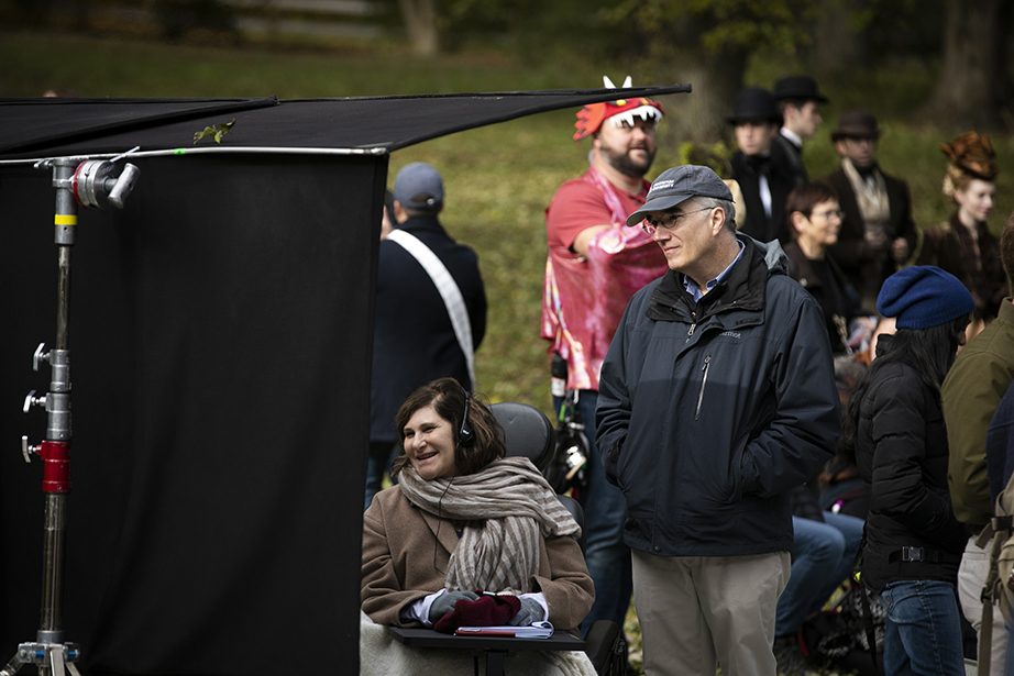The Arnold Arboretum at Harvard University is transformed for a day during the filming of The Little Women. Amy Pascal (left) and Ned Friedman are pictured on set. Stephanie Mitchell/Harvard Staff Photographer