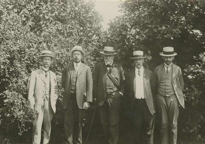 Charles S. Sargent and Ernest H. Wilson standing in front of a Higan Cherry tree (Prunus subhirtella)