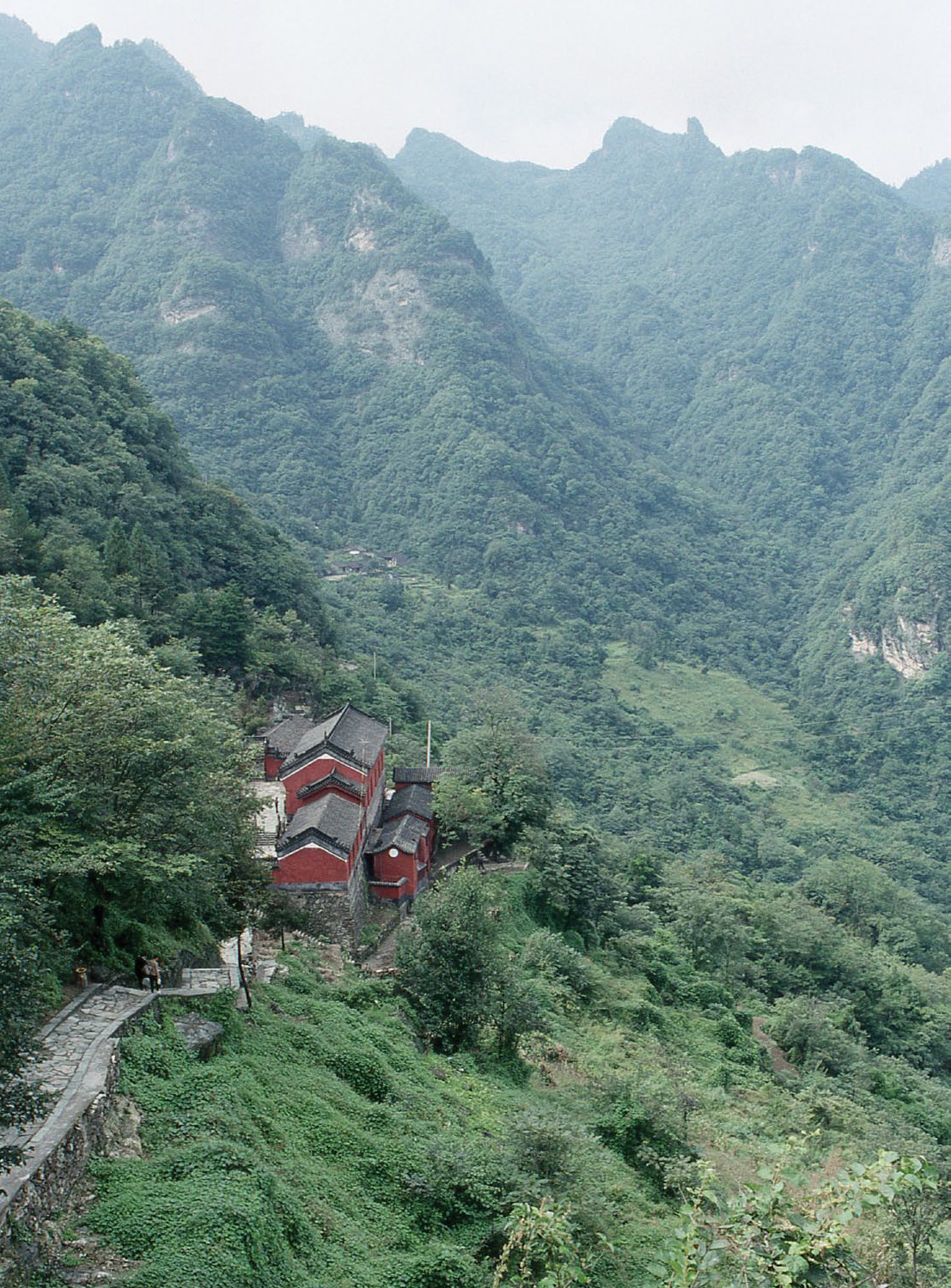 Photo of temple on tucked on mountain slope
