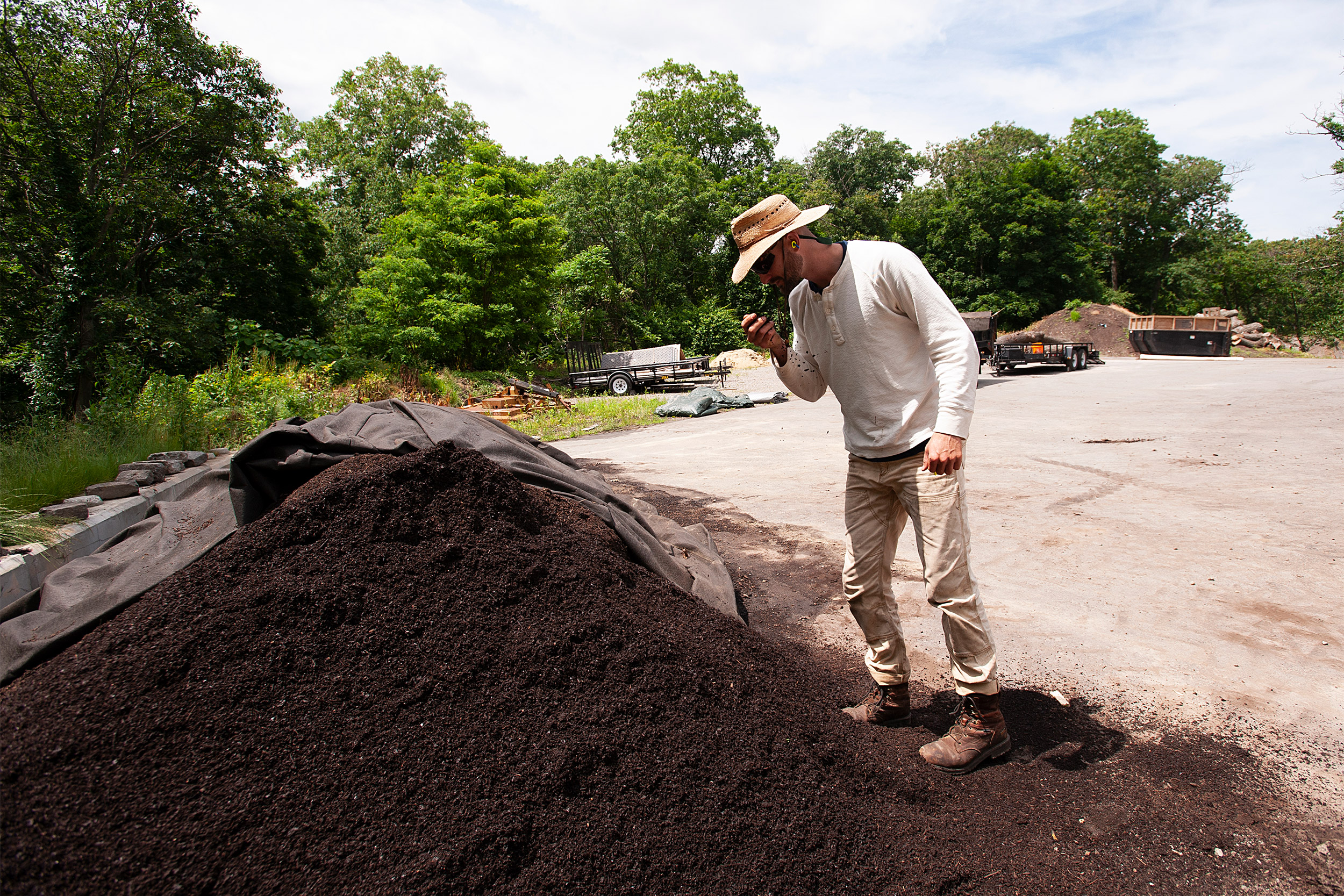 Conor Guidarelli examining screened compost pile