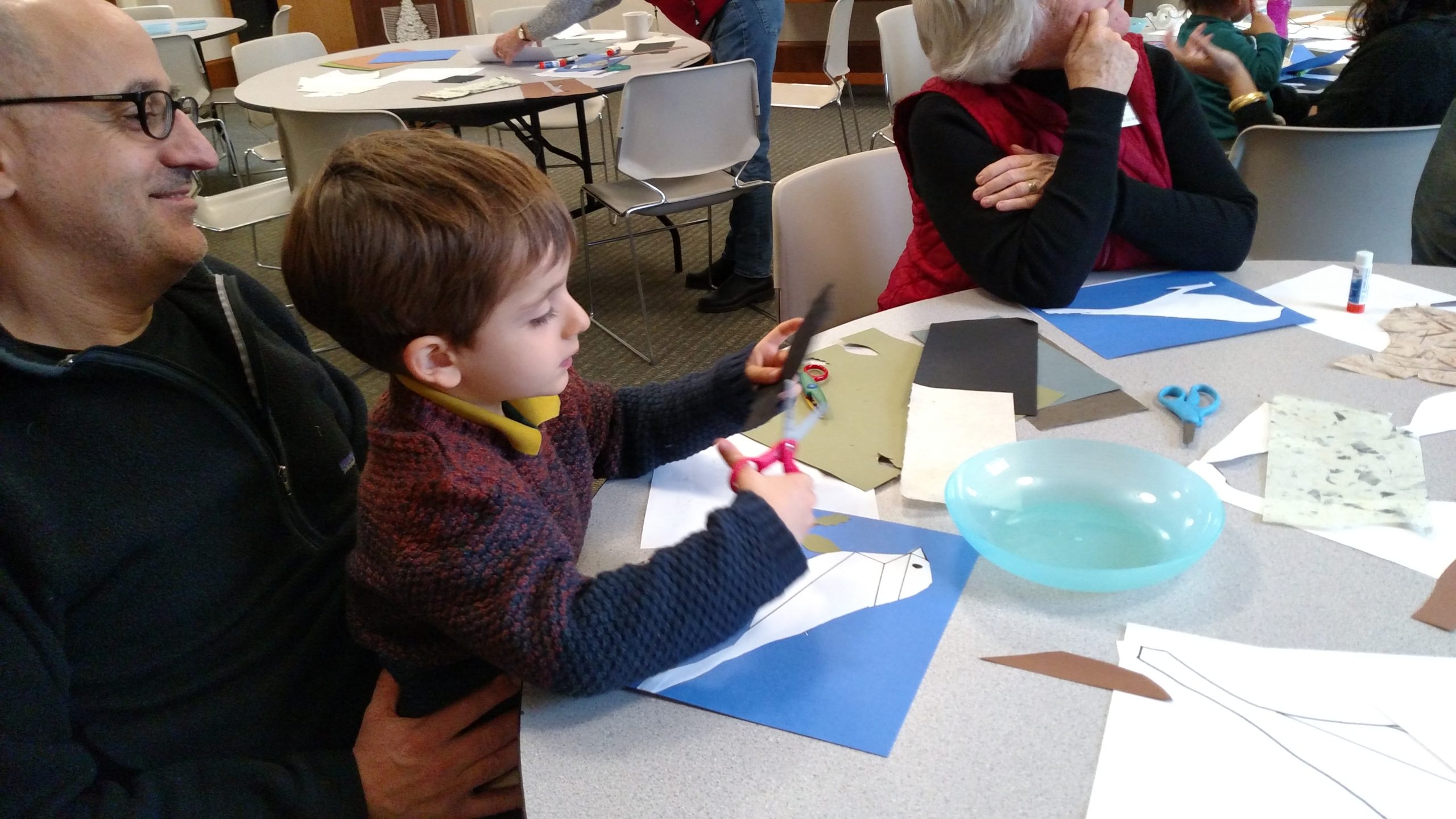 Child doing bird papercraft