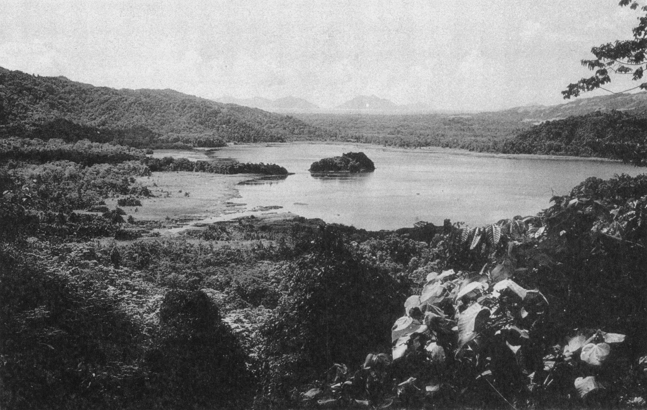 View northeast over Lake Lavu to Hughes Bay on Fergusson Island and the high Amphlett Islands from about 700 feet (210 meters) on the Fagululu-Agamoia trail.