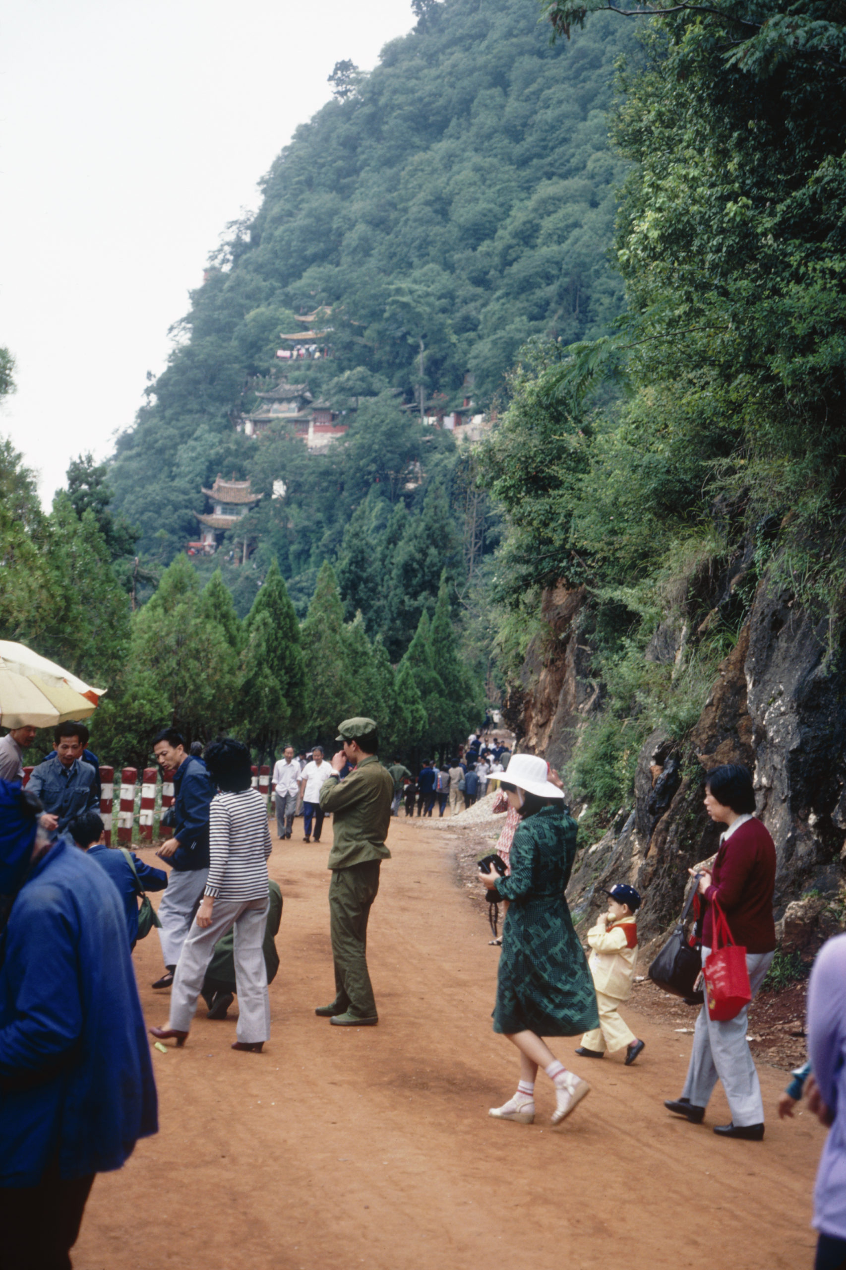 Tourists visiting scenic spots and temples on Xi Shan west of Kunming, Yunnan.