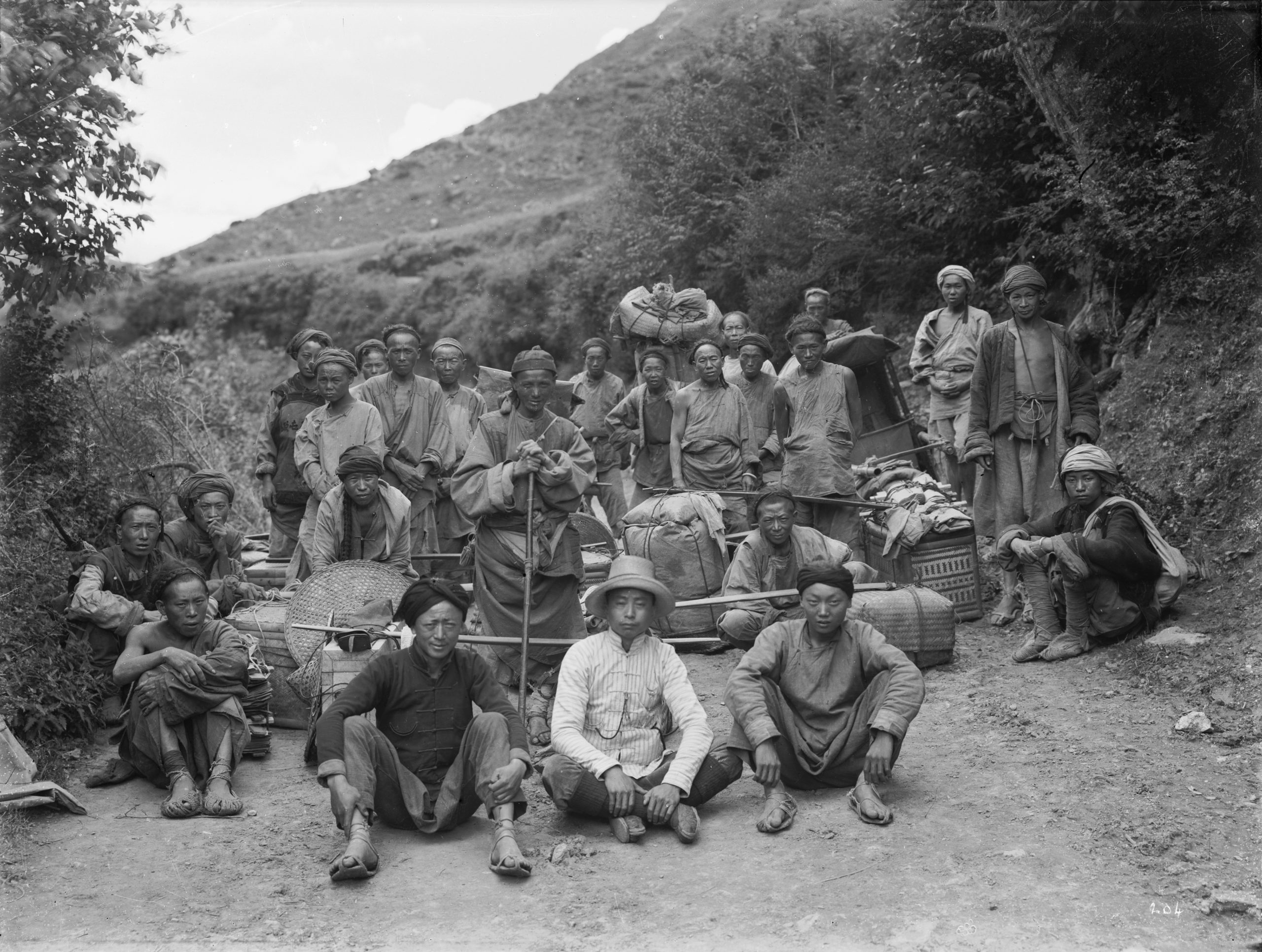 Ernest Wilson photographed his expedition team and their gear in July 1908 after crossing from Kuan Hsien to Kangding (Tachien-lu), a distance of approximately 330 miles (100 kilometers).