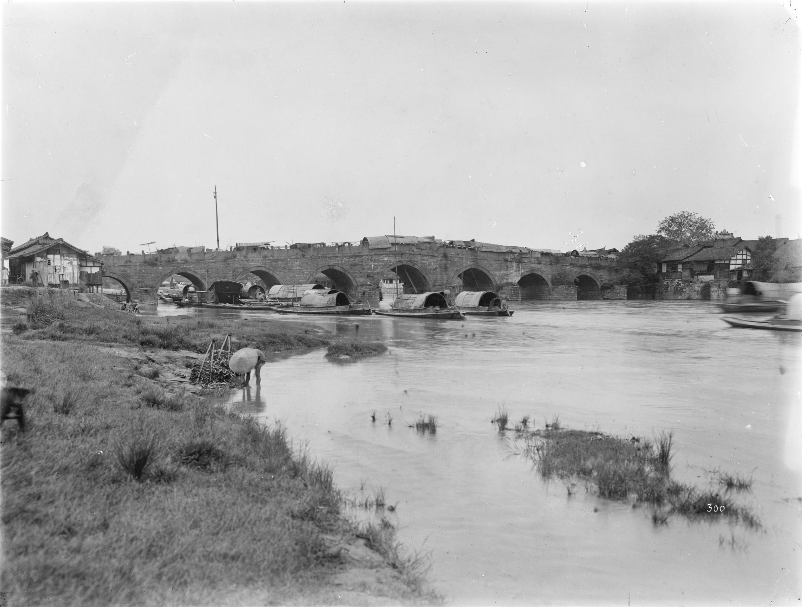 The 'Marco Polo Bridge' built of blocks of red sandstone, outside the east gate of Chengdu (Chentu Fu), in a photograph of Ernest Wilson in August 1908.