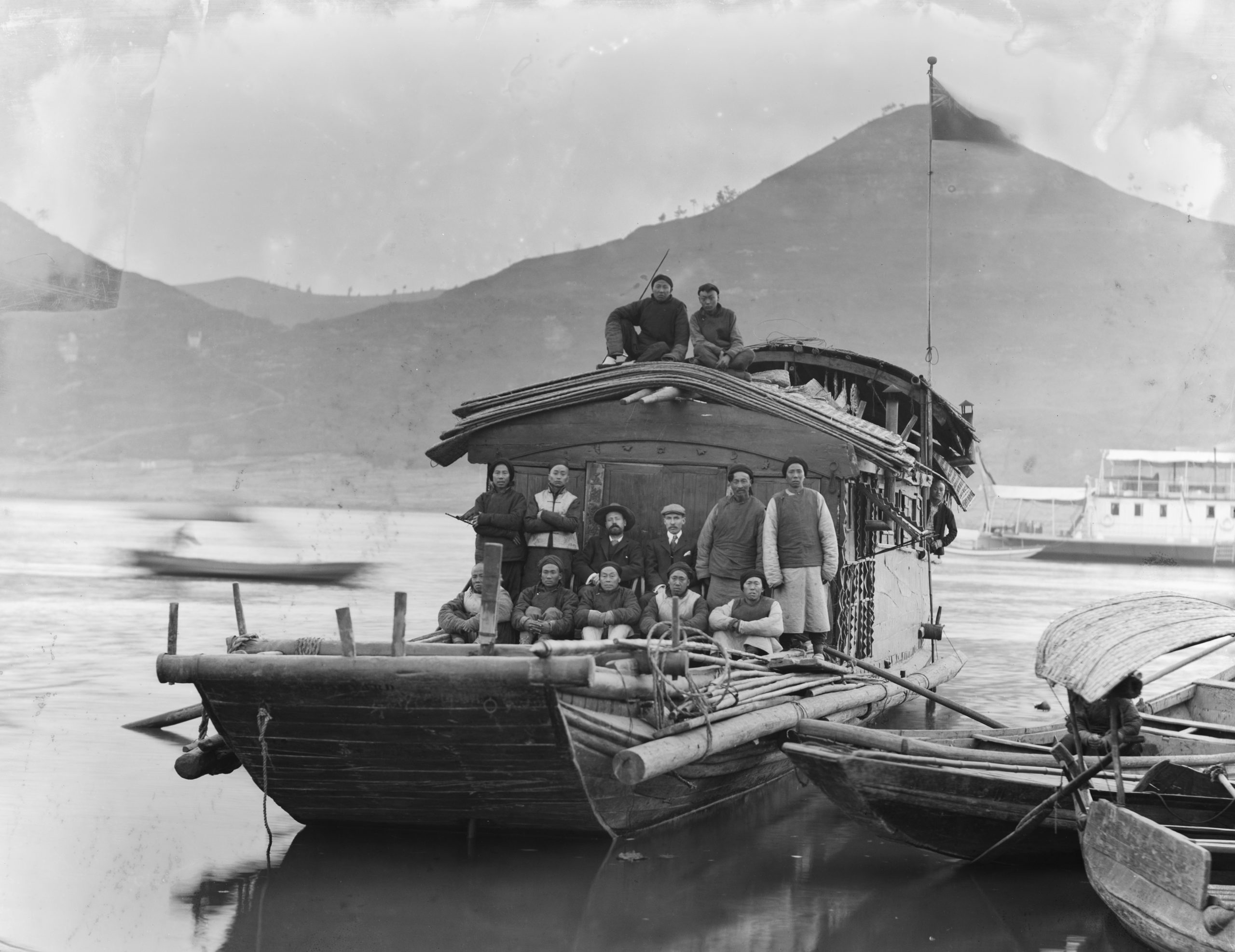 Ernest Wilson (center left), Walter Zappey (center right), and Wilson's collecting team, on their houseboat, the "Harvard."