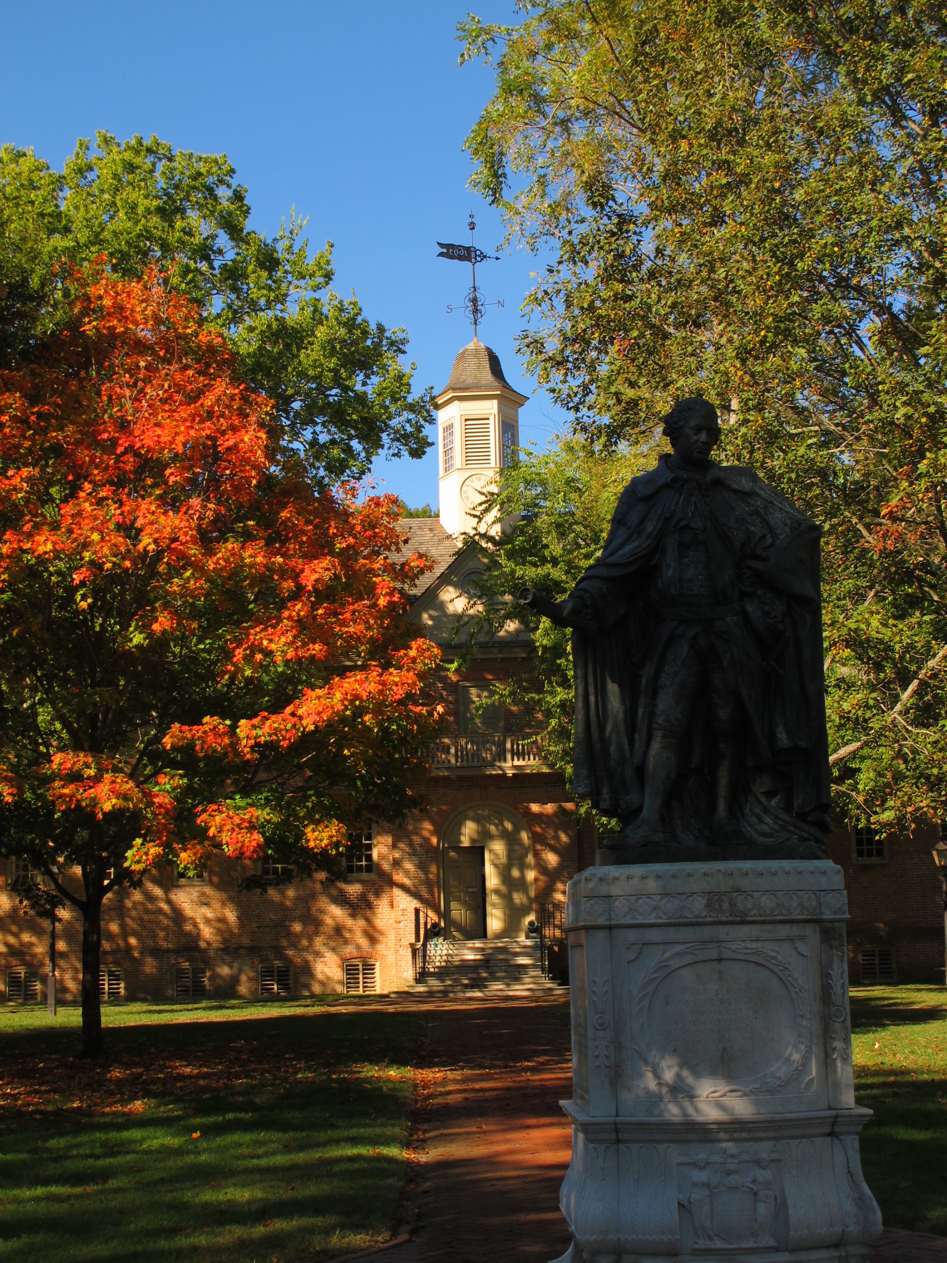 A statue of Virginia governor Lord Botetourt stands out front of the Wren building at the College of William and Mary.