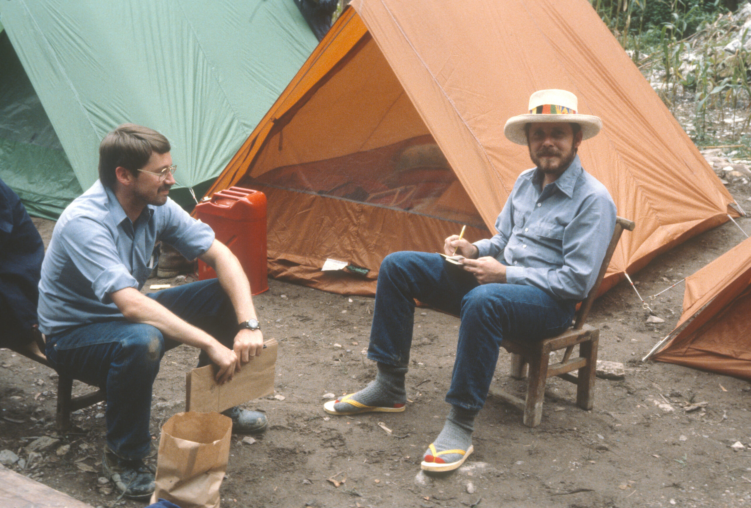 James Luteyn and Bruce Bartholomew relax in camp near the Mengjia River.