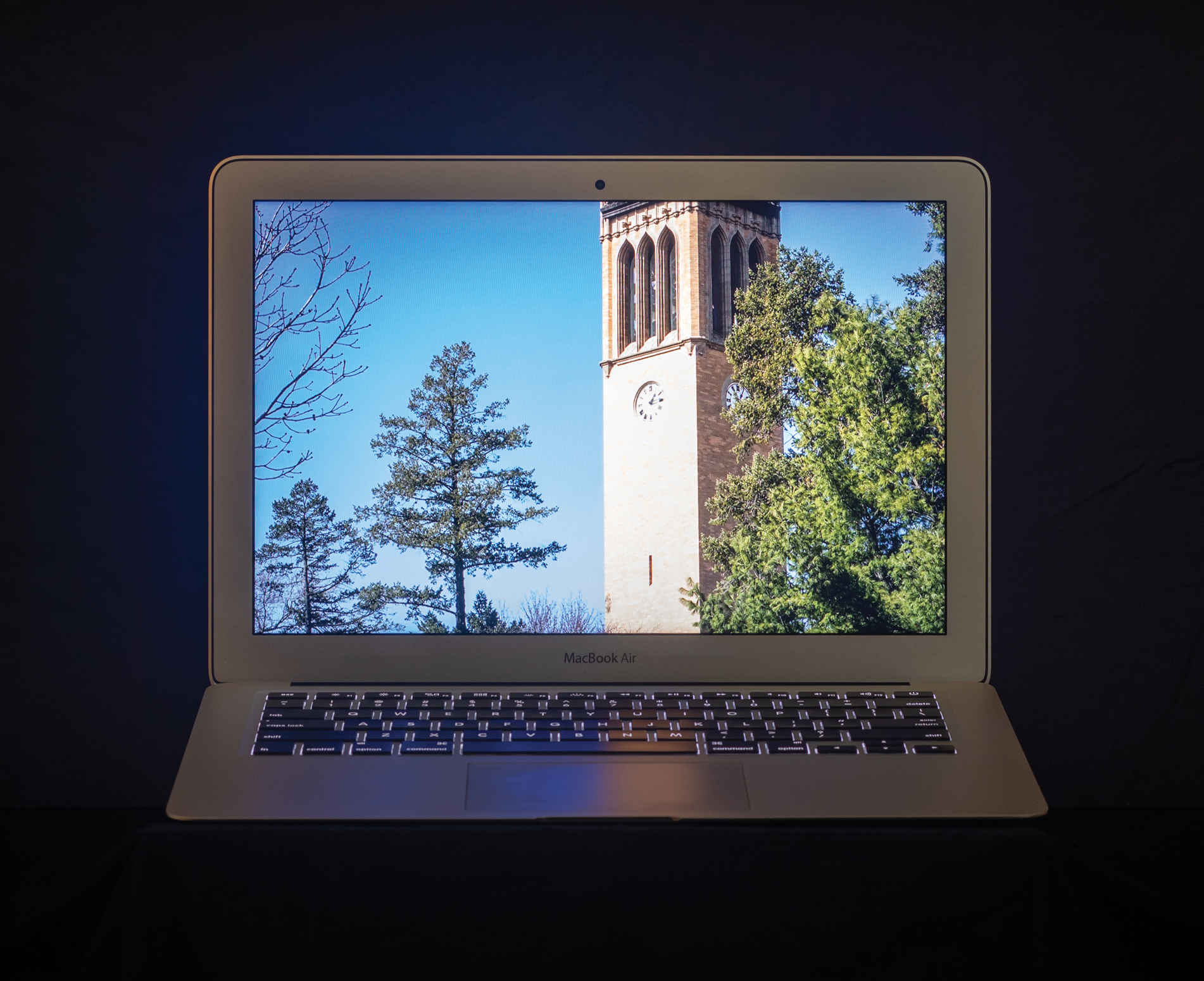 Photograph of bell tower at Iowa State University displayed on laptop screen