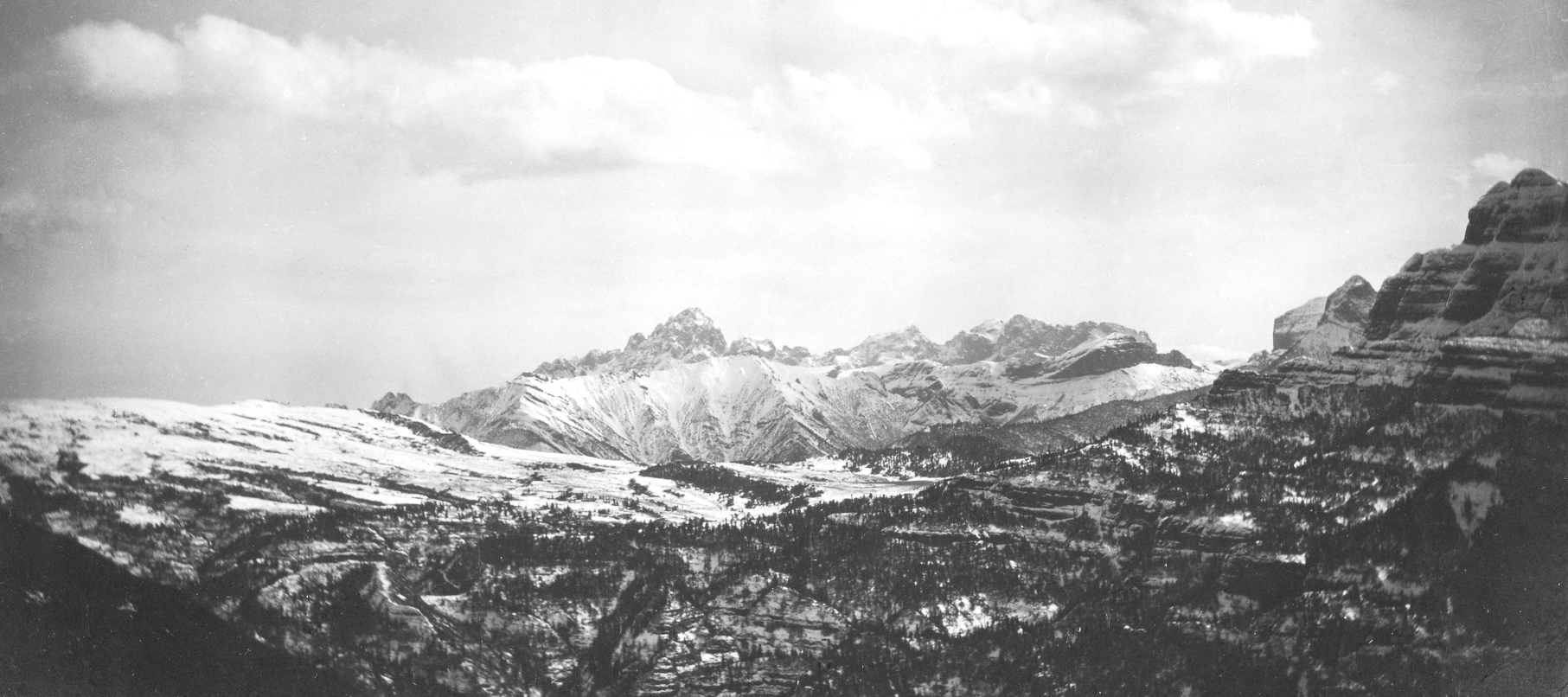 Black-and-white photograph of snow-capped mountains