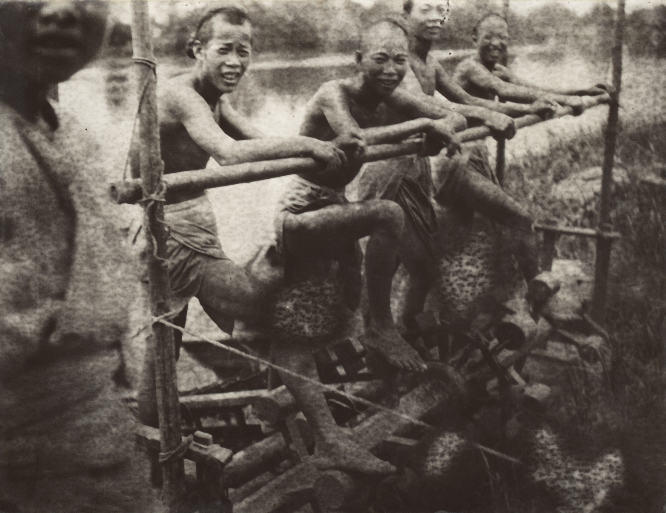 Laborers pumping water into a rice field pause for a moment in June 1907 for Frank Meyer's camera. 