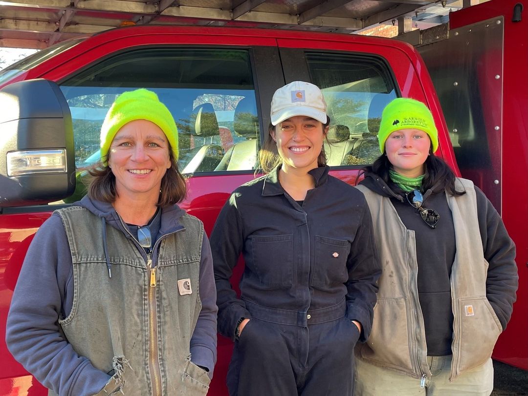 Laura Mele, Vanessa Igoe, and Rachel Lawlor standing in front of a truck.