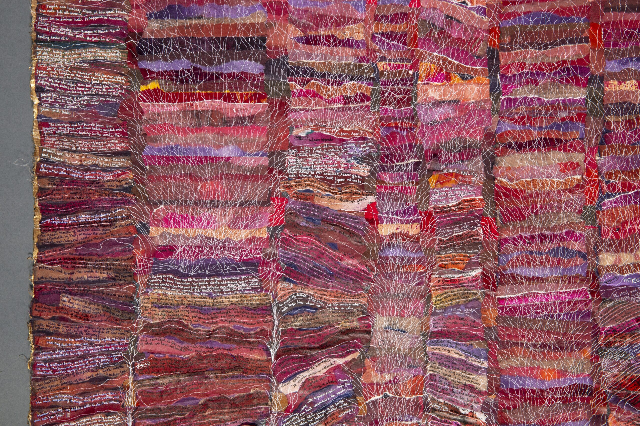 Art detail, vaious colors, scraps of fabric, tiny white lines and text