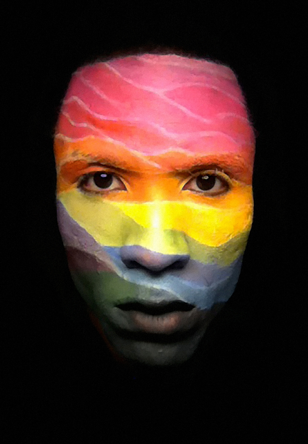 Man with his face painted artistically in rainbow colors