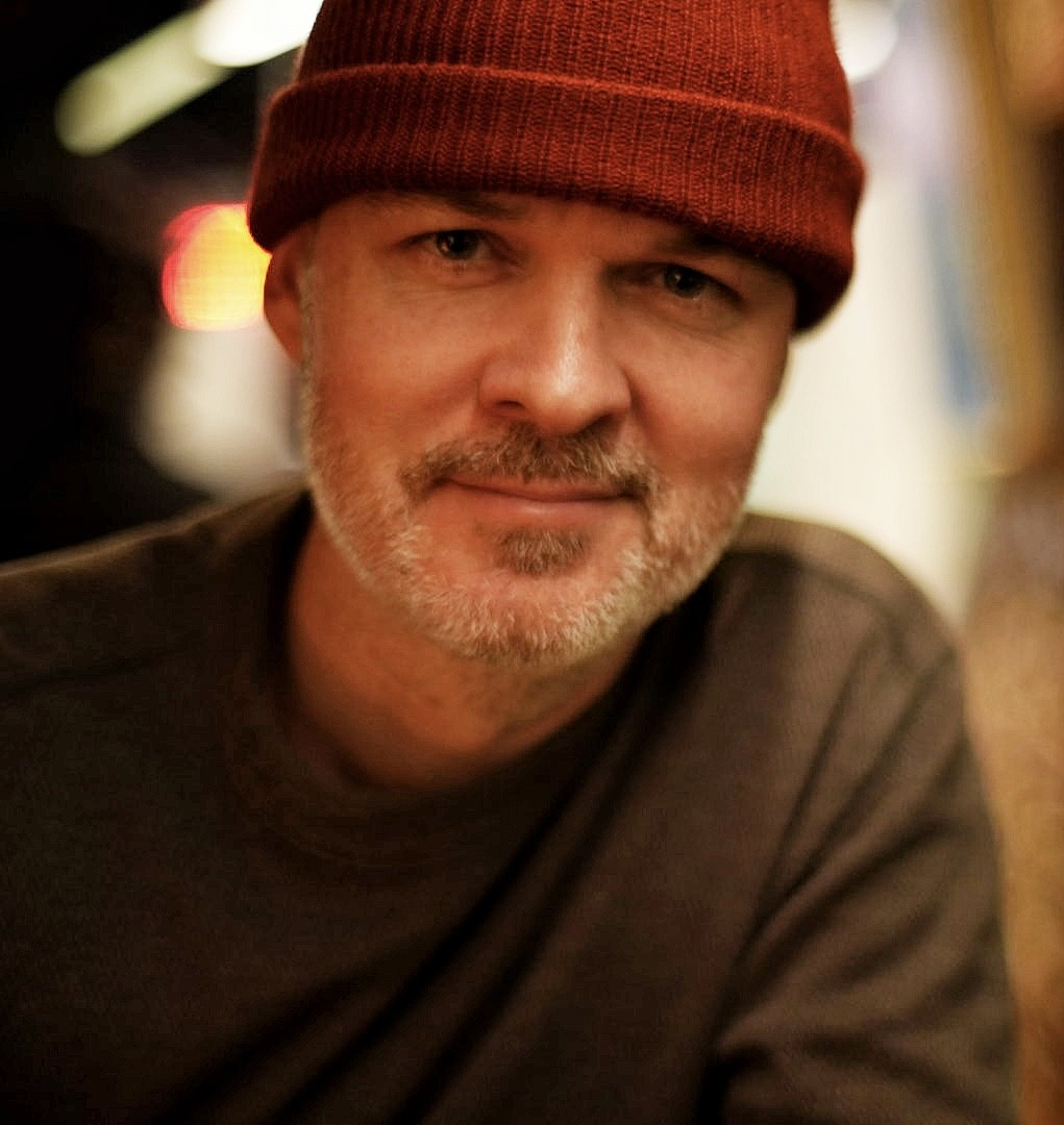 Head shot of Logan Nutter in a red knitted hat